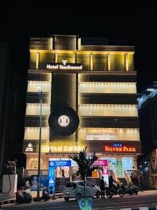 a building with a car parked in front of it at HOTEL TOUCHWOOD in Visakhapatnam