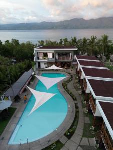 an aerial view of a resort with a large swimming pool at Bakawan Hideaway Resort and Restaurant in Tomas Oppus