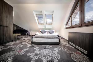 Postel nebo postele na pokoji v ubytování Hotel Zacisze