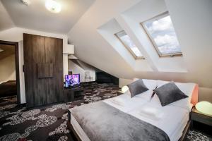 Postel nebo postele na pokoji v ubytování Hotel Zacisze