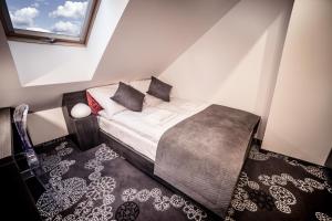 Postel nebo postele na pokoji v ubytování Hotel Zacisze