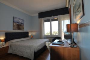 Postel nebo postele na pokoji v ubytování Hotel Sole Mare + 29 fotografií