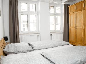 Ein Bett oder Betten in einem Zimmer der Unterkunft Ferienwohnungen Merl