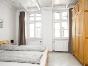 Ein Bett oder Betten in einem Zimmer der Unterkunft Ferienwohnungen Merl