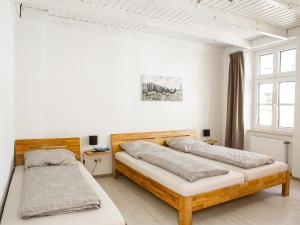 Ein Bett oder Betten in einem Zimmer der Unterkunft Ferienwohnungen Merl