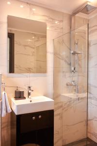 a bathroom with a sink and a shower at Florina Sky Loft in Florina