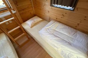 Postelja oz. postelje v sobi nastanitve 富士山下Trailer House-B