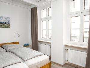 Ein Bett oder Betten in einem Zimmer der Unterkunft Ferienwohnungen Merl