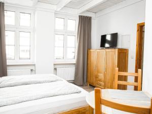 Ein Bett oder Betten in einem Zimmer der Unterkunft Ferienwohnungen Merl