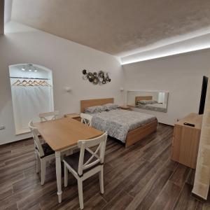 Postel nebo postele na pokoji v ubytování B&B Il Rosone