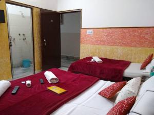 Postel nebo postele na pokoji v ubytování Agra Paying Guest House + 19 fotografií