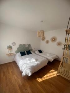 a bedroom with two beds and a ladder at Casa Rural La Chicuela 