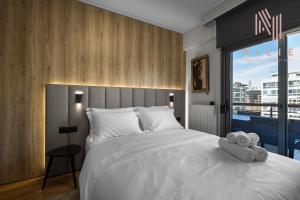Ένα ή περισσότερα κρεβάτια σε δωμάτιο στο Green Tulip, Nilie Hospitality MGMT