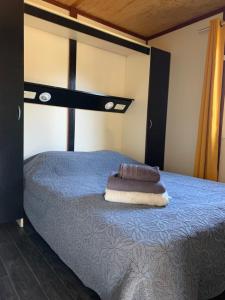 Postel nebo postele na pokoji v ubytování L'Aravone Lodge