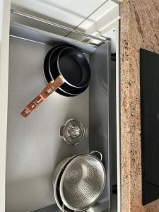een koelkast met een pot en pannen erin bij New 2023 full equipped stylish digi in Los Realejos
