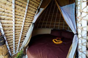 an overhead view of a bed in a tent at Maha Gangga Valley by ecommerceloka in Tirtagangga
