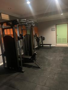 a gym with several tread machines in a room at May Flower Apart Hotel in Alanya