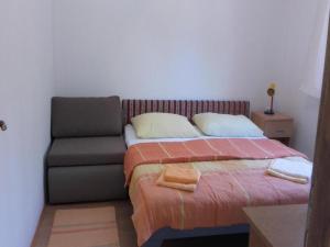 Posteľ alebo postele v izbe v ubytovaní Apartments Smilje i Maslina