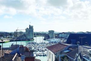 a harbor with a bunch of boats in the water at Old Port - Terrace with exceptional view! in La Rochelle