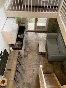 an overhead view of a kitchen with a table and stairs at Plantage Garden Apartments in Amsterdam