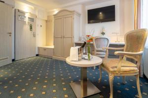 TV a/nebo společenská místnost v ubytování Hotel St Georg - Regensburg + 37 fotografií