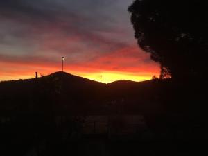The sunrise or sunset as seen from az apartmanházakat or nearby