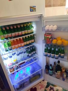 an open refrigerator filled with lots of drinks at MY HOME in Beysehir