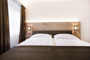 Krevet ili kreveti u jedinici u okviru objekta Romantik Hotel le Vignier