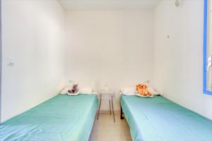 Postel nebo postele na pokoji v ubytování Mallorca 15 Canyelles Roses - Immo Barneda