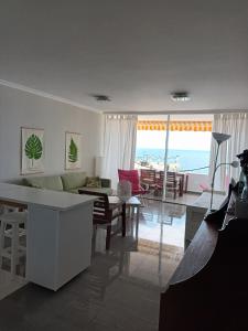A seating area at Great oportunity Costa Adeje Holiday apartment first sea line Free Wifi