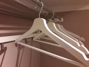a bunch of white hangers hanging from a ceiling at FerienNest Kelheim in Kelheim