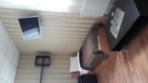 an overhead view of a room with a bed and a television at Leon Hotel in Lviv