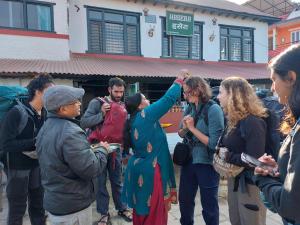a group of people standing in front of a building at Hasera Organic Farmstay: Farm to Table & Mountain View in Dhulikhel