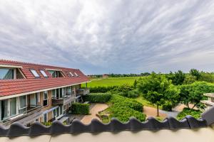 an aerial view of a house with a garden at Résidence Terschelling in Midsland