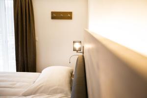 Krevet ili kreveti u jedinici u okviru objekta Romantik Hotel le Vignier