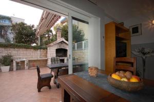 a living room with a table and a fireplace at Apartment Džoni in Split