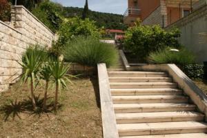 a set of stairs leading up to a house at Apartment Džoni in Split
