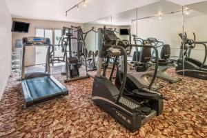 a gym with treadmills and elliptical machines at Ramada by Wyndham Las Cruces Hotel & Conference Center in Las Cruces