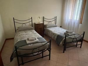 Postel nebo postele na pokoji v ubytování Sole dei Colli