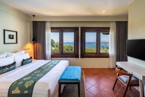 Voodi või voodid majutusasutuse Sundancer Residences and Villas Lombok toas