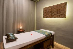 Voodi või voodid majutusasutuse Sundancer Residences and Villas Lombok toas