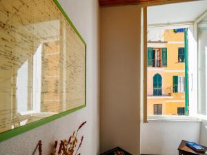 a window in a room with a map on the wall at Macaia Village Life Room with AC #2 in Vernazza