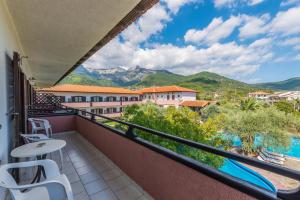 a balcony with a view of the mountains at Natasa Hotel in Skala Potamias