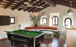a living room with a pool table and a couch at Catalunya Casas Divine and Delightful for 24 guests 12km to Sitges in Olerdola