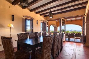 a dining room with a table and chairs at Villa Paraiso - PlusHolidays in Benissa