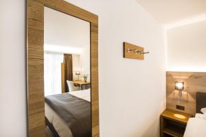 Krevet ili kreveti u jedinici u okviru objekta Romantik Hotel le Vignier