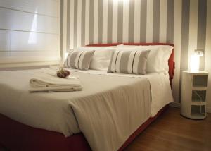 Ένα ή περισσότερα κρεβάτια σε δωμάτιο στο La Cittadella