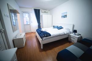 Katil atau katil-katil dalam bilik di FOR-A Apartmani