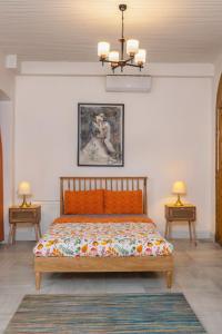 a bedroom with a bed with a painting on the wall at 9 Pera in Istanbul