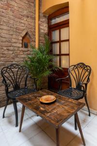 a wooden table and chairs on a patio at 9 Pera in Istanbul